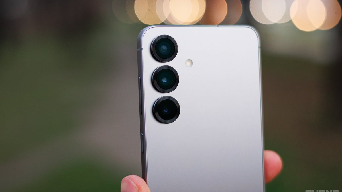 A close up shot of three cameras on a phone's back with a blurred out background.