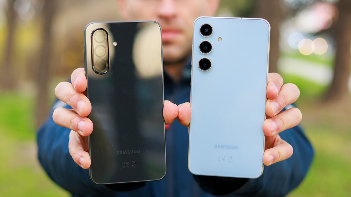 Person holding Galaxy A36 and Galaxy S24 FE